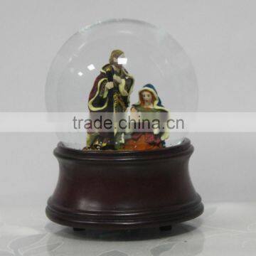 Nativity snow gloge with music box wood grain base