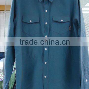 Men's blue long sleeve shirt with two chest pockets and button up