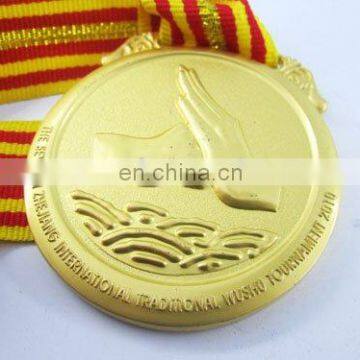 sports souvenir gold medal with ribbon