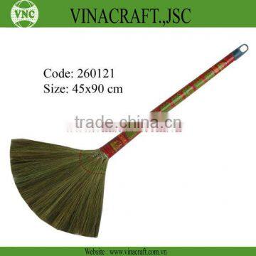 Grass broom with long handle covered by plastic fibers