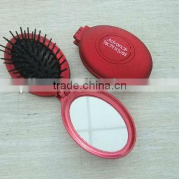 AVON plastic fold mirror with brush