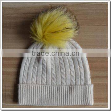 Cashmere knitted cable with fur ball hat