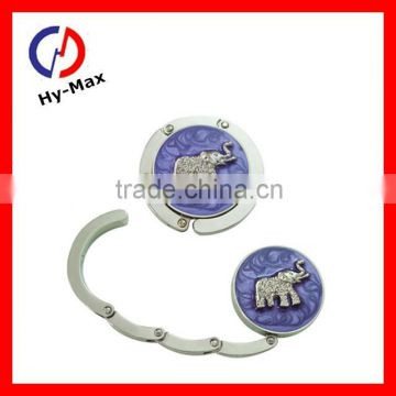 metal round bag hanger in acrylicstone with elephant pattern