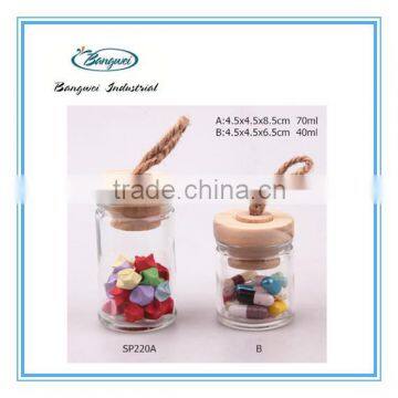 glass spice jar with wooden lid and spoon