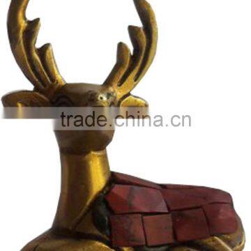 brass deer with stone work