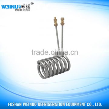 Immersion type titanium cooled evaporator