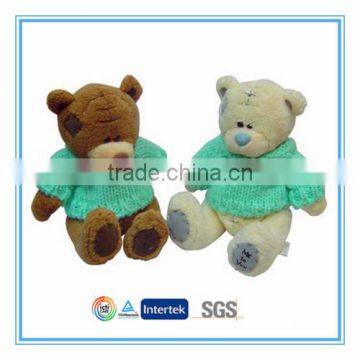 Cute plush teddy bear with sweater