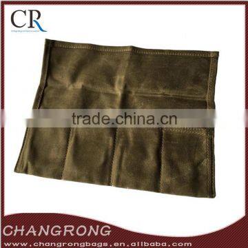 folded waxed canvas watch roll with leather trim