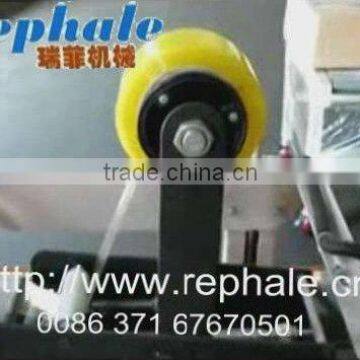 High speed adhesive tape sealing machine