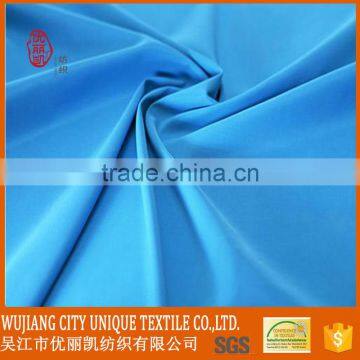 100gsm light blue color 100% polyester microfiber peach skin fabric for beach pants