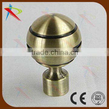 Spay-painted curtain rod finial of gold curtain rod