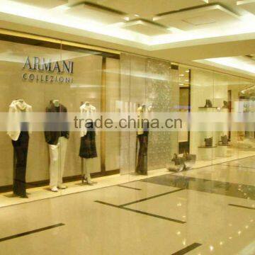 Most elegant lines and simple color custom clothing store display design