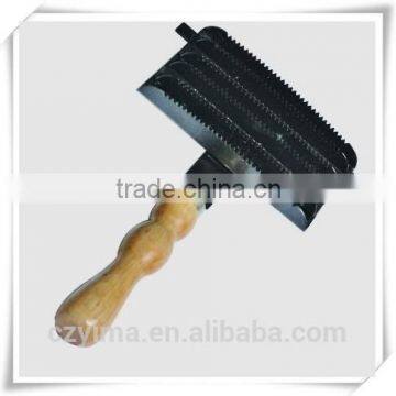 metal horse curry comb with rounded wooden handle