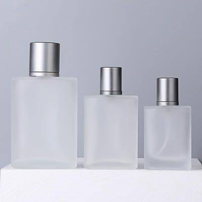 Hot selling 30ml 50ml 100ml square shape flat shoulder frosted clear glass spray bottles perfume dispenser