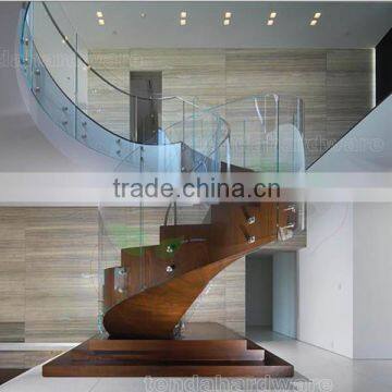 indoor stainless steel standoffs frameless glass balustrades with curved wood staircase