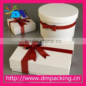 christmas white paper gift box with red ribbon