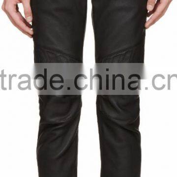 Slim-fit leather biker-style trousers in black. Five-pocket styling. Zip pockets at waist. Panelling at thighs. Zippered