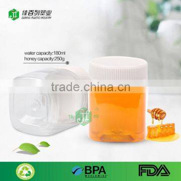 200ml pet bulk wholesaler factory BPA free empty clear food grade plastic 280g jar with aluminium cap mini fancy jar of honey