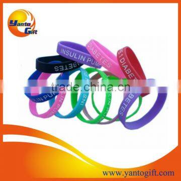 Debossed ink filled silicone wristband