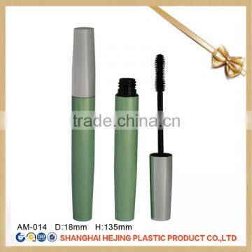 Empty green aluminum mascara tube