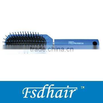 small oval hairbrush with black cushion