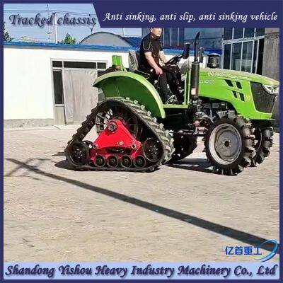 Agricultural tractor modified with triangular track wheels for anti-skid and anti sinking