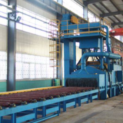 Cleaning various profiles, steel pipes, and inner and outer walls of pipes using a roller through shot blasting machine