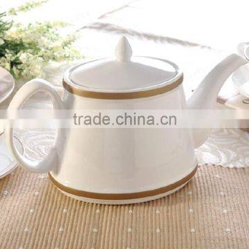 white porcelain ceramic tea pot with color line