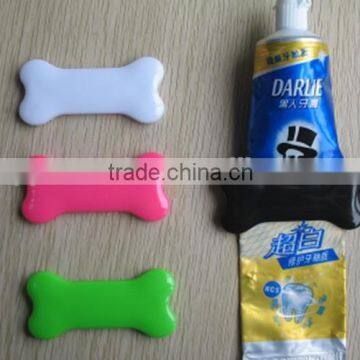plastic bone shape toothpaste squeezer