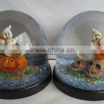 Plastic pumpkin halloween snow globe