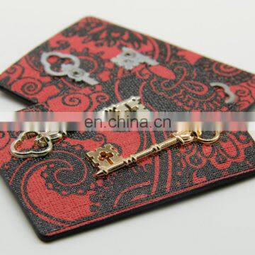 fancy pu leather label with metal badge for garment