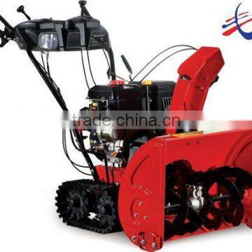 Two-stage track snow thrower