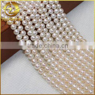 loose white round freshwater natural cheap cultivated pearl stands aaa