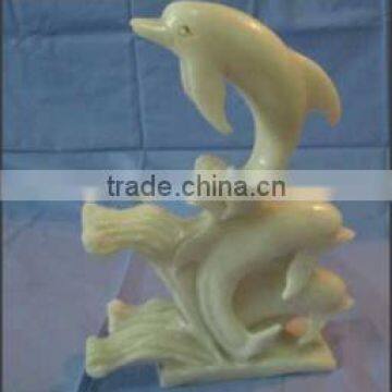 Stone Carving Three Dolphins On Waves - DHUH682