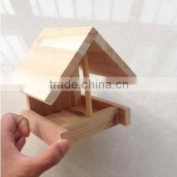 Garden wooden bird feeder and house