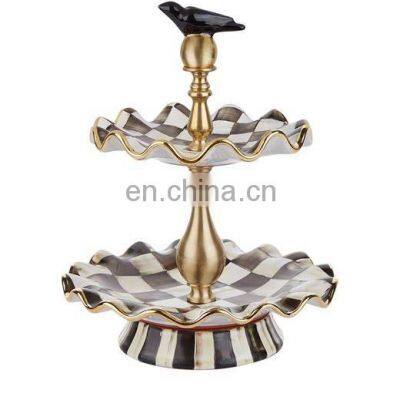 black & white cake stand with bird top