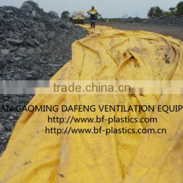 Yellow Layflat vent ducting for mining operation