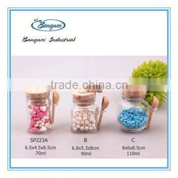 glass spice jar with wooden lid and spoon