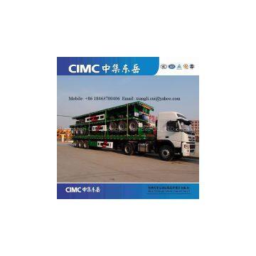 Tri-axle flatbed trailer with 12 units container locks