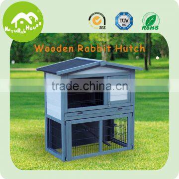 white 2 story wooden rabbit hutch