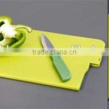 plastic cutting board with knife