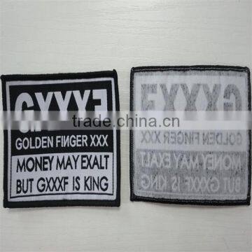 High Quality Black Black Background White Logo Merrow Border Woven Label