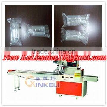 Small plastic bottle flow wrapping machine