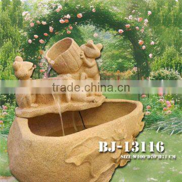 flowing water yellow sandstone fountain