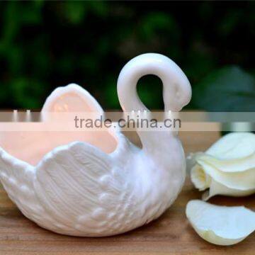 ceramic swan candle holder in swan candle container