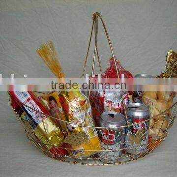 Gold egg shaped wire portable storage basket with fruits