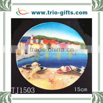 Resin wall plaque with boat and seaside village design