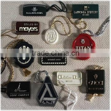 garment brand logo embossed plastic string tags