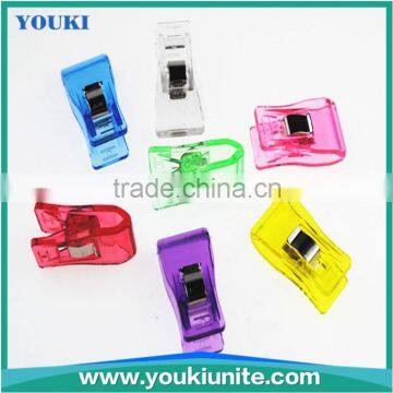 Transparent plastic spring clip