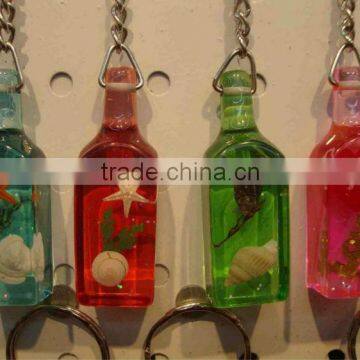 Bottles amber keyring with sea shell inset,Promotional rosin keyring,amber keychain pendant